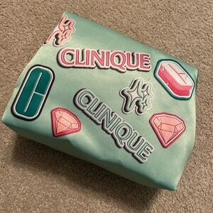 Clinique mint green satiny material makeup bag. New never used.